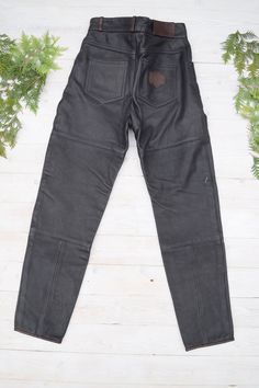 "Strong un and thick leather moto pants in excellent condition. PLEASE CHECK ALL MEASUREMENTS BELLOW: Length: 106 cm / 42\" Waist: 72 cm / 28\" Hips: 102 cm / 40\" Inseam: 77 cm /30\" Fabric: leather, polyester Brand: Frank Thomas Condition: excellent * dry clean only LOOK FOR OTHER COOL VINTAGE CLOTHING HERE: https://www.etsy.com/shop/OnTheRoadStore KEEP IN MIND: Photo might be slightly different from actual item in terms of color due to the lighting during photo shooting or your monitor's disp Biker Style Leather Pants For Streetwear, Fitted Leather Biker Pants For Motorcycling, Black Leather Moto Bottoms, Black Leather Moto Pants, Black Biker Leather Pants For Winter, Black Moto Leather Pants, Black Leather Biker Pants, Black Fitted Leather Pants For Motorcycling, Fitted Black Leather Pants For Motorcycling