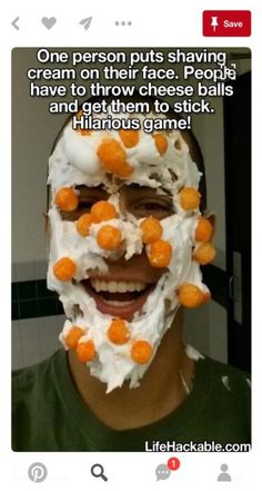 a man with his face covered in whipped cream and orange candies is smiling at the camera