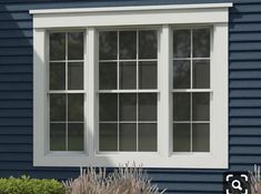 a black house with white trim and windows