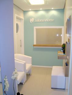 the interior of a dental office with white chairs