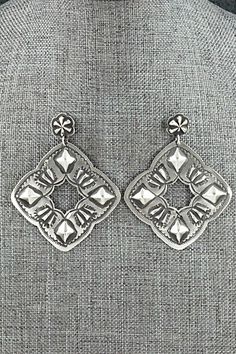 "These beautifully crafted sterling silver earrings were made by Navajo silversmith Lane Tahe. The backs are signed and stamped sterling. Length: 2 3/8\" Width: 1 7/8\" Free shipping on all orders! We ship with USPS and always include tracking. All orders ship within a day of payment. Returns are accepted up to 30 days after you receive your order. Just send us a message. Our shop offers cash back or store credit. The item must be returned in new condition." Artisan Stamped 925 Earrings, Artisan Sterling Silver Etched Earrings, Artisan Etched Sterling Silver Earrings, Traditional Concho Earrings For Gift, Traditional Concho Earrings As Gift, Silver Concho Drop Earrings, Silver Concho Dangle Earrings, Silver Dangle Earrings With Concho, Sterling Silver Concho Dangle Jewelry