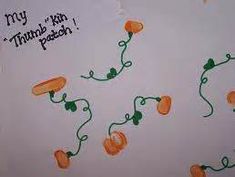 an image of carrots on a white paper with green string attached to the top