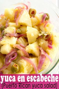 a bowl filled with pineapple and red onion salad on top of a white table