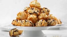 a white bowl filled with cookies on top of a table