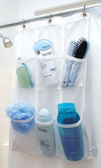 the bathroom organizer is organized with mesh bags and toothbrushes on it's side