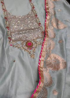 Item Overview ATHARVA Hand Embroidered Salwar Kameez w/Beautuful All Over Block Print & Hand Embroidery in Blue Chanderi/Elegant Banarsi Silk Dupatta Dno. CH1261 Fabric:  * Shirt Chanderi 2.5 Mts, Block Print, All over Embroidery in Sky Blue * Dupatta: Banarsi Silk Dupatta 2.5 Mts. * Bottom Santoon Silk 2.5 Mts. Excusive Hand Embroidered Party Wear Punjabi Suit. Customization: * Fabrics Customization: Designs Can be made in different Fabrics. * Color Customization: Designs Can be made in differe Semi-stitched Dola Silk Salwar Kameez With Mirror Work, Blue Dola Silk Unstitched Suit For Wedding, Blue Dola Silk Unstitched Wedding Suit, Dabka Work Embroidered Fabric For Wedding Straight Kurta, Party Dupatta With Multicolor Embroidery In Dola Silk, Silk Embroidered Unstitched Suit For Diwali, Embroidered Unstitched Suit For Diwali Wedding, Multicolor Embroidered Dabka Work Kurta For Wedding, Embroidered Semi-stitched Dola Silk Anarkali Set