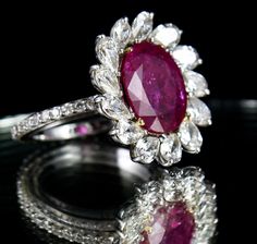 PRODUCT DETAILS PCS 1/CTS 3.85 NATURAL RUBY OVAL  PCS 13 /CTS 2.35 DOUBLE CUT PEAR DIAMOND  PCS 35 /CTS 0.53 DOUBLE CUT SMALL DIAMOND 4.374 GRAM 18K WHITE GOLD  5.720 GRAM GROSS WEIGHT NATURAL UNTREATED RUBY CERTIFIED BY LAB  SIZE ADJUSTABLE RING FITTED  FINE MAKING IN 18K WHITE GOLD NOTE - #You will receive the same product you see in picture. #DEAR BUYERS PLEASE FEEL FREE TO ASK QUESTIONS  #WE WILL BE GLAD TO ANSWER & SOLVE QUERY REGARDING THIS PRODUCTS #RETURN POLICY Every piece of jewellery and inputs (gem stones, diamonds, making and setting) is tested by our team of experts and experienced artisans to generate maximum satisfaction to our valued customers. Customer satisfaction is our primary goal. All information about the material used in jewellery, except for typographical errors, Luxury Pear-shaped Ruby Ring, Luxury Ruby Ring With Oval Center Stone, Exquisite Oval Ruby Ring Gia Certified, Luxury Oval Ruby Ring With Center Stone, Luxury Oval Ruby Ring With Prong Setting, Luxury Marquise Ruby Ring, Luxury Oval Ruby Ring With Gemstone, Exquisite Oval Ruby Ring With Center Stone, Luxury Pear-shaped Ruby Ring For Formal Occasions