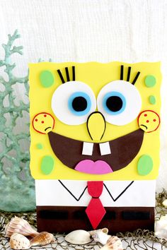 a paper cut out of spongebob wearing a tie