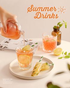 a person pours a drink from a pitcher into a glass on top of a plate