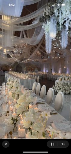 an image of a wedding setup with flowers and candles on the tables in front of them