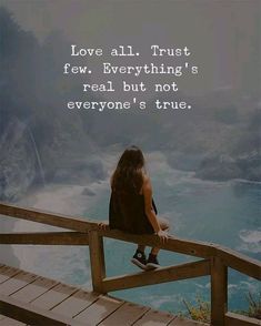 a woman sitting on a wooden railing looking at the ocean with a quote about love all trust few everything's real but not everyone's true