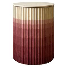 a round wooden table with red and beige stripes on it's sides, against a white background