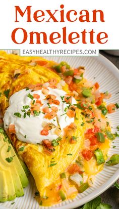 mexican omelette on a plate with avocado and sour cream in the middle