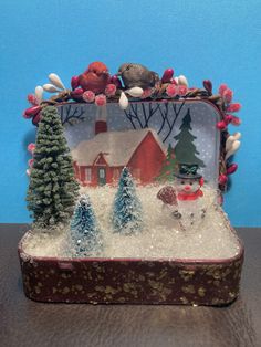 a small christmas scene with snow and trees