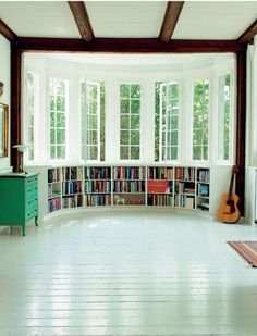 there is a room with many books on the shelves