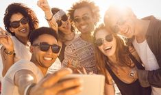 a group of friends taking a selfie on the beach - stock photo - images