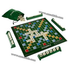 the scrabble board game is shown with its accessories