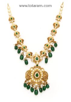 22 Karat Gold "Peacock" Necklace with Cz, Color Stones, Pearls & Beads (Temple Jewellery)

 Enhance Your Beauty with Our Exquisite 22 Karat Gold "Peacock" Necklace Indulge in the exquisite craftsmanship of our 22 Karat Gold "Peacock" Necklace, meticulously made in India by our skilled artisans at Totaram Jewelers. This stunning piece is adorned with sparkling CZ, colorful stones, lustrous pearls, and delicate beads, creating a mesmerizing temple jewelry design that will surely make you stand out Kundan Necklace With Peacock Design For Reception, Peacock Colored Jewelry For Weddings And Festivals, Green Bridal Necklace With Peacock Design For Celebration, Gold Necklace With Peacock Design For Receptions, Festival Reception Kundan Necklace With Peacock Design, Wedding Necklace With Peacock Design In Peacock Color, Gold Bridal Necklace With Peacock Design For Reception, Peacock Design Necklace For Wedding, Traditional Kundan Necklace With Peacock Design For Reception