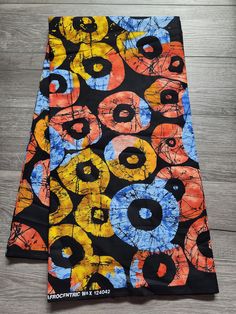 African Ankara Print Fabric. This is fabric is sold by the fold and each fold is approximately a yard.  This fabric is 100% cotton and has a width of 44in.  It can be used make different clothing, quilting and other sewing projects. Purchases of more than a yard, it will come in a continuous piece We ship via USPS First Class Mail, USPS Priority mail or UPS Multicolor Batik Print Cotton Fabric, Cotton Batik Print Multicolor Fabric, Cotton Fabric With Multicolor Batik Print, Black Cotton Fabric With Colorful Pattern, African Quilts, Clean And Press, Ankara Print, African Ankara, African Print Fabric