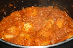 the food is cooked and ready to be eaten in the pot on the stove top