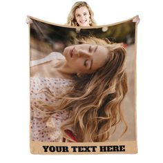 a woman with long blonde hair is holding up a personalized photo on a blanket