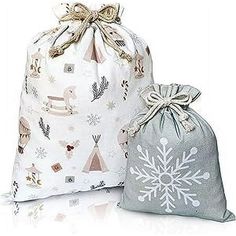 two bags with snowflakes on them are sitting next to each other and one bag has