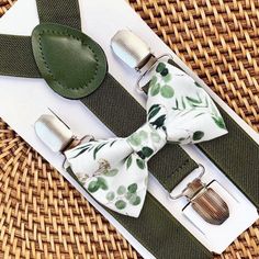 This floral sage green bow tie & suspenders set is a great choice for mens suspenders, women suspenders, suspenders men, groomsmen in a wedding, sage bow tie, ring bearer outfit, moss bowtie, or any other special occasion. ❤ **Please Specify**   Bow Tie Only (w/ Clip or Neck Strap), Suspenders Only, or Bow Tie Only & Susp (Bow Tie and Suspenders) SUSPENDERS- One Pair of our Quality Suspenders BOW TIE - One Bow Tie on White Adjustable STRAP or Alligator CLIP **CLIP ON Bow Ties are Recommended/Suitable for Children Only *Sizing: Please Check Measurements Before Ordering *Note: If your gentleman wears larger clothing for his age, we recommend going by the clothing size to be safe. Any other questions on this, please just ask!  Small: 6 months- 6 years Medium: 7 years- 12 years Adult: 13 years Ring Bearer Sage Green, Sage Green Ring Bearer, Ring Bearer Outfit Green Bowtie, Green Adjustable Tie For Groom, Adjustable Green Bow Tie For Father's Day, Adjustable Green Tie With Bow Tie Back, Women Suspenders, Suspenders Women, Sage Green Bow Tie And Suspenders