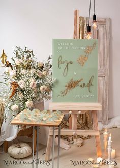 an easel with a sign that says welcome to the bride and groom