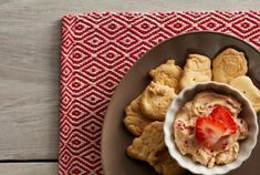 a plate with cookies and fruit on it