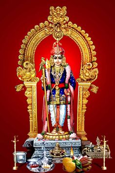 the statue of lord rama is surrounded by fruits and other items on a red background