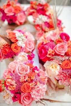 wedding bouquets are arranged on a table