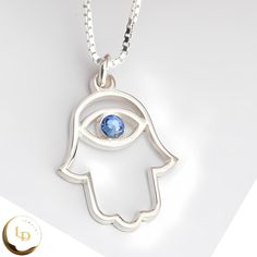 This stunning Birthstone Hamsa Necklace is a unique piece of Evil Eye Jewelry from Jerusalem that will surely bring you protection and good luck.  Handcrafted with care, the Hamsa pendant is made of 925 Sterling Silver, 24k Gold Plated, or Rose Gold, adding a touch of elegance to your look.  The Birthstone embedded in the pendant adds a personalized touch, making this necklace a meaningful gift for yourself or a loved one.  Embrace the ancient symbolism of the Hamsa and wear this beautiful neckl Evil Eye Hamsa, Gold Hamsa, Hamsa Pendant, Hamsa Necklace, Evil Eye Jewelry, Eye Jewelry, Elegant Gift, Chain Styles, Meaningful Gifts