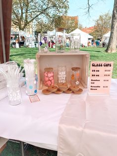 a table with glasses on it at an outdoor event