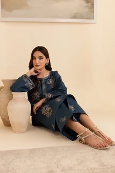 Batik Embroidered Lawn Dress Adira 2Pc Embrace tradition with our Pakistani outfits online. This ready-to-wear 2Pc dress in premium Pima lawn features a straight fit shirt with an embroidered neckline and composed motifs. The loose fit sleeves are adorned with embroidered borders and lace. Paired with embroidered cambric culottes, it captures the essence of celebration. Premium Pima lawn Embroidered neckline Straight fit shirt Embroidered cambric culottes Note: Colors may slightly vary due to li Blue Embroidered Dress For Diwali, Designer Wear Embroidered Dress With Dabka, Blue Traditional Straight Kurta Dress, Traditional Blue Straight Kurta Dress, Unstitched Embroidered Blue Dresses, Blue Traditional Dress With Resham Embroidery, Blue Resham Embroidered Traditional Dress, Traditional Blue Dress With Resham Embroidery, Blue Dabka Dress For Eid