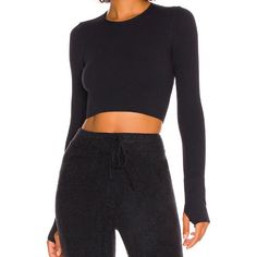 This fashionable women's top features a long-sleeved design with a threaded yoga belt and built-in chest pad, providing both style and support. Ideal for niche fashion enthusiasts, it seamlessly transitions from dance practice to outdoor sports, ensuring comfort and performance. Fitted Crop Top With Thumbholes For Yoga, Yoga Crop Top With Thumbholes, Versatile Workout Crop Top For Fall, Versatile Yoga Crop Top For Fall, Versatile Fall Crop Top, Solid Long Sleeve Yoga Crop Top, Versatile Long Sleeve Crop Top For Gym, Seamless Long Sleeve Crop Top For Yoga, Long Sleeve Seamless Crop Top For Yoga