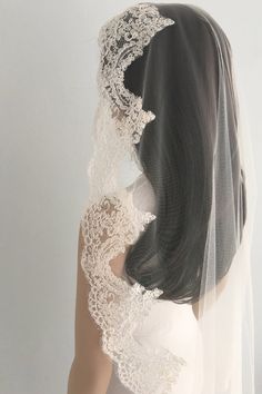 the back of a woman's head wearing a veil