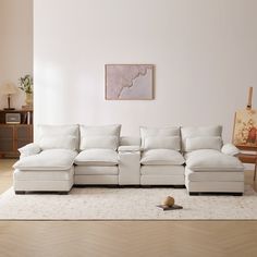 a living room with a large white sectional couch