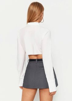 Achieve an effortlessly sophisticated look with this white crop shirt from our collection. Featuring a long sleeve lapel neck and front pocket, it's finished with an asymmetrical hem for an air of modernity. Crafted with luxurious fabrics, it will elevate any outfit, adding a touch of elegance. Material:90% Polyester, 10% Spandex White Long Sleeve Cropped Shirt For Fall, Spring Office Cropped Shirt With Long Sleeves, Spring Office Cropped Long Sleeve Shirt, Spring Long Sleeve Cropped Shirt For Office, Fitted Long Sleeve Cropped Shirt For Work, Chic Cropped Shirt For Office, Trendy White Long Sleeve Cropped Shirt, Chic Button-up Crop Top For Work, Elegant White Crop Top For Workwear