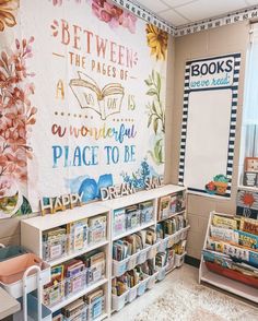 the children's library has many books on shelves and posters above them that say, between the pages of a book is a wonderful place to be