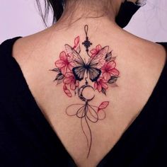 a woman with a butterfly tattoo on her back