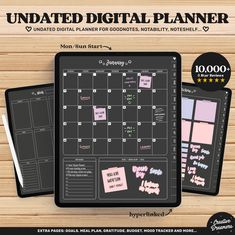 the undated digital planner is shown on a wooden table with pink and black stickers