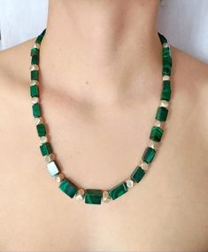 Unique beaded necklace in a beautiful green shade, handmade with natural Malachite cube beads, combined with alternating 925 Sterling Silver faceted beads.  Beads graduate in size from 8.5 mm to 5 mm.925 Sterling Silver clasp.Length 55 cm (21.6 in)All items are delivered ready for gift-giving. Please don’t hesitate to contact me if you have any questions regarding this item. I’ll be happy to assist you.Thank you for visiting my shop. View additional designs herehttps://www.etsy.com/shop/Chrissil Green Beaded Rectangular Necklace, Green Rectangular Beaded Necklace, Rectangular Green Beaded Necklace For Gift, Green Rectangular Beaded Necklace Gift, Green Rectangular Gemstone Beads Jewelry, Green Beads Necklace, Silver Beaded Necklace, Green Beaded Necklace, Cube Beads