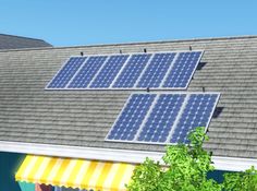 two solar panels are on the roof of a house with trees in front of it