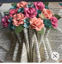 an origami flower bouquet made out of book pages