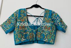 Pure silk Blue Maggam work blouse with zari and stone work on sleeves ,neckline and back of the blouse , inside soft pad provided Measurements: 38 allowance provided This blouse can be made in colors of your choice too. Disclaimer - Actual colors may vary slightly due to computer monitors displaying settings. We try hard to match exact color.This blouse can be made in any color of your choice. For customized stitching please send measurements after placing order. Note: All blouses front neck wil Designer Wear Padded Choli, Wedding Saree With Padded Blouse, Traditional Semi-stitched Saree With Padded Blouse, Designer Saree Blouse With Zari Work, Traditional Saree Choli With Padded Blouse, Traditional Saree With Padded Blouse, Traditional Designer Wear Choli With Padded Blouse, Traditional Designer Padded Blouse Choli, Traditional Designer Padded Blouse Piece