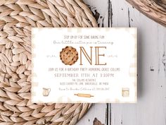 a cookie themed birthday party is set up on a table next to a wicker basket