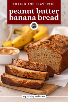 a loaf of peanut butter banana bread sitting on top of a cutting board next to bananas