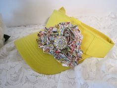 I désigned the adorable yellow golf sun visor making a darling variegated shabby flower. I added a beautiful pearl with yellow rhinestone accent to the center. This visor is so cute. Visor has velcro back. See more of my golf sun visors here: https://www.etsy.com/shop/theraggedyrose?ref=seller-platform-mcnav&section_id=26493513 Trucker Baseball and Cadet Hats Here: https://www.etsy.com/shop/theraggedyrose?ref=seller-platform-mcnav&section_id=10557807 Thanks for taking the time to visit m Yellow Visor Baseball Cap For Summer, Yellow Summer Visor Baseball Cap, Yellow Baseball Cap For Spring, Yellow Baseball Cap For Beach In Spring, Spring Yellow Adjustable Mini Hats, Yellow Mini Hats One Size Fits Most, Cadet Hats, Golf Visor, Cadet Hat