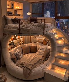 a spiral bed is in the middle of a room with stairs leading up to it