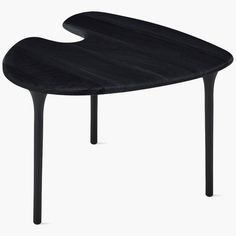 a black table with an upside down design on it's top and legs, against a white background